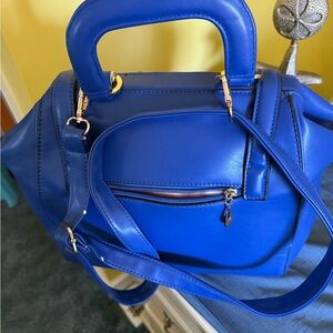 NWT Women’s handbag, blue, faux leather, strap or handles, satin lining